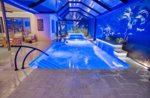 new pool construction blue led lighting screened enclosure night florida